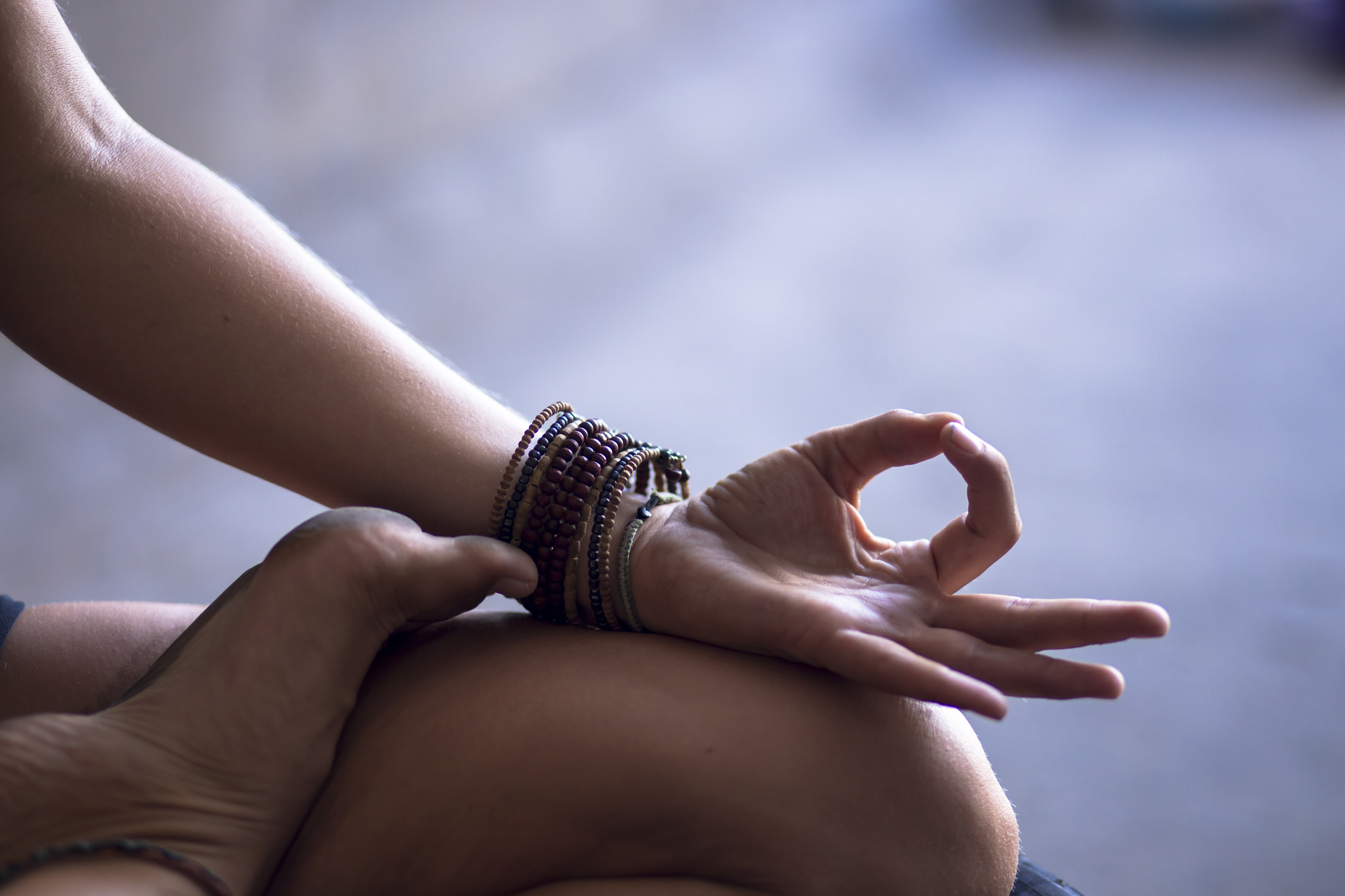 Image of a womans hand practicing yoga